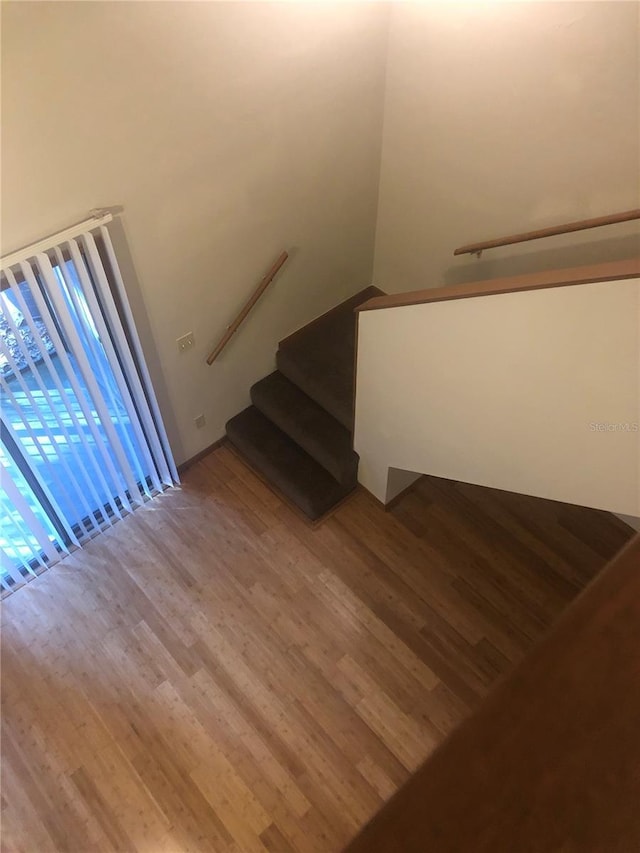 stairway featuring hardwood / wood-style floors