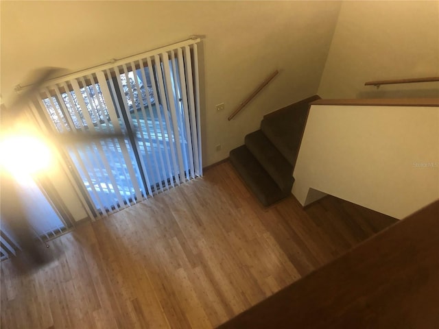 stairway featuring hardwood / wood-style flooring