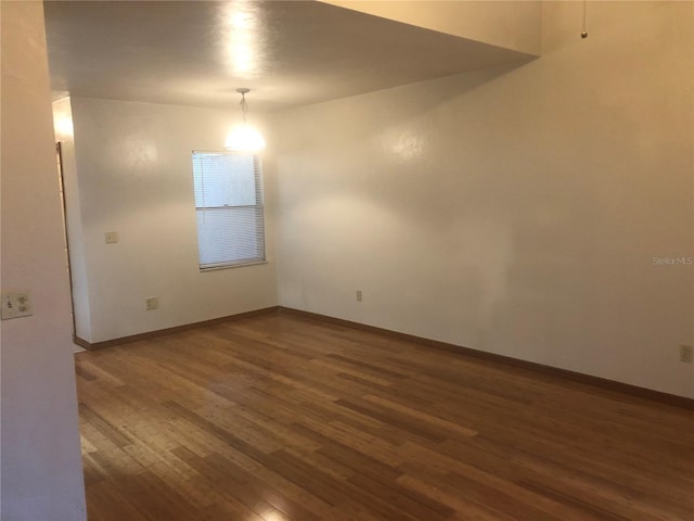 empty room featuring dark hardwood / wood-style floors