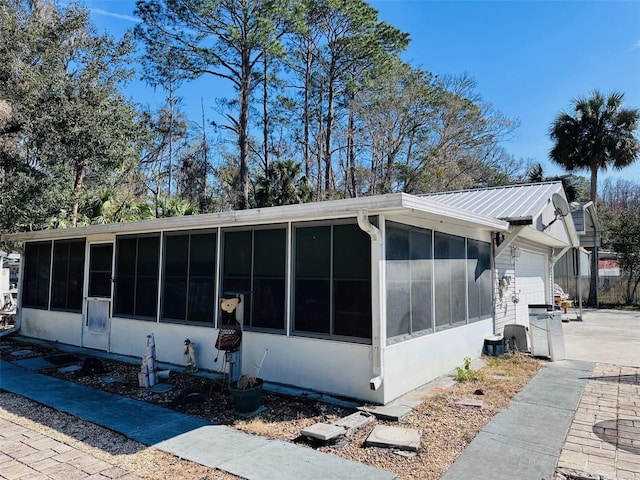 view of property exterior with a garage