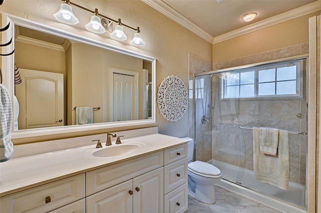 bathroom with vanity, crown molding, a shower with door, and toilet