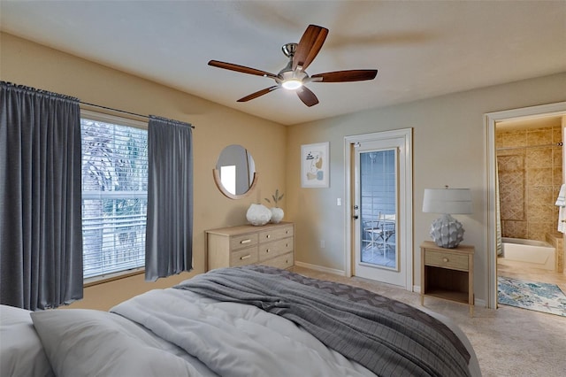 bedroom featuring ceiling fan, ensuite bath, light carpet, and access to outside