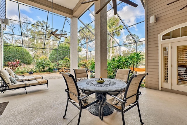 sunroom featuring ceiling fan