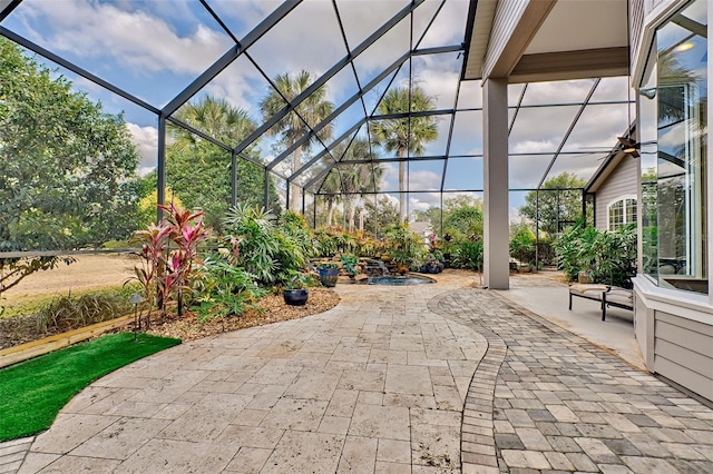 view of patio / terrace with a lanai