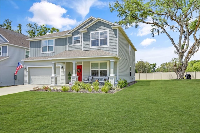 craftsman house featuring a garage, a front yard, and a porch