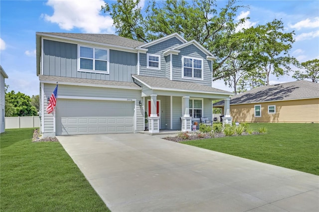 craftsman-style house with a garage, a front yard, and a porch