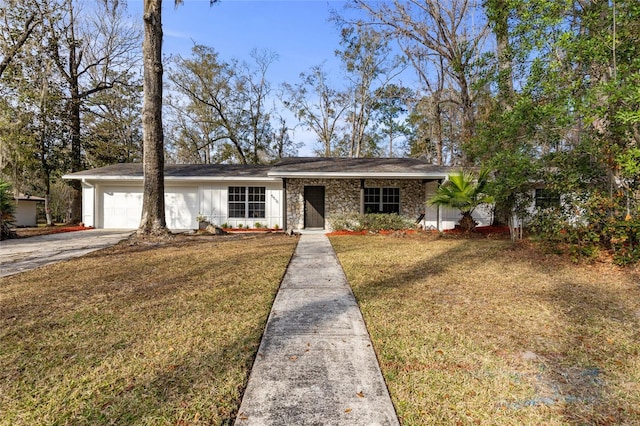 single story home featuring a garage and a front lawn