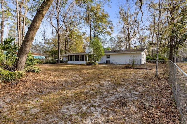 view of yard featuring a sunroom