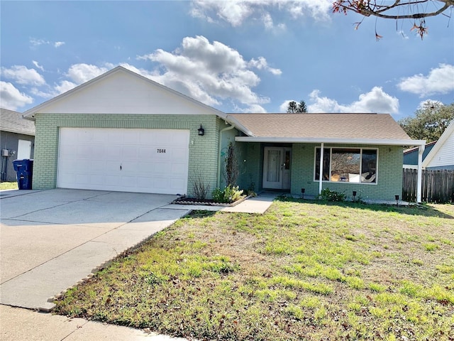 7644 Arlight Dr, New Port Richey, FL 34655 - ranch-style home featuring a garage and a front lawn