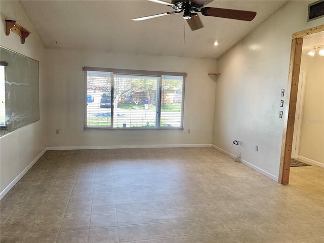 unfurnished room featuring vaulted ceiling and ceiling fan