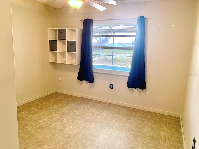 spare room featuring ceiling fan