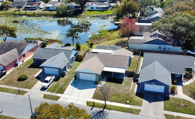 birds eye view of property with a water view