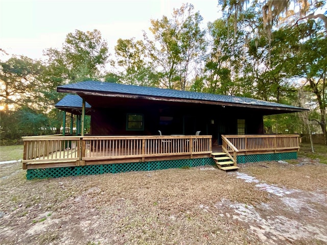 view of front of home featuring a wooden deck