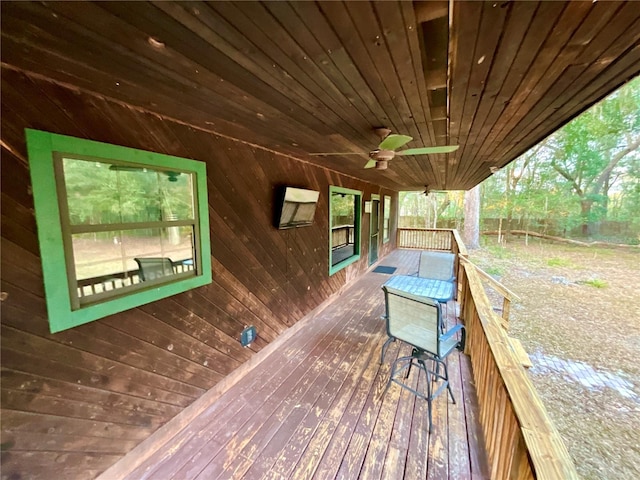 wooden terrace featuring ceiling fan