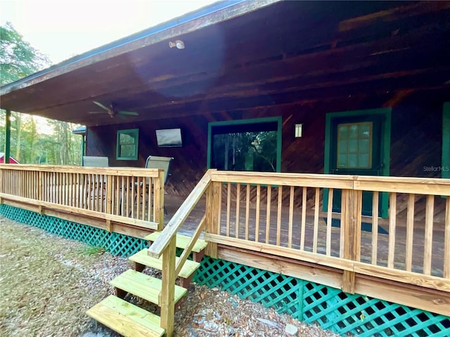 wooden deck featuring ceiling fan