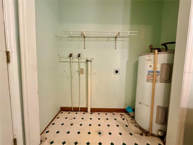 laundry room featuring electric water heater