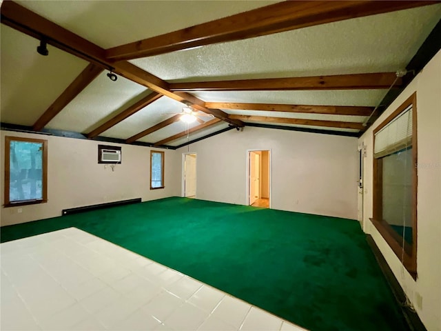 interior space featuring a wall unit AC and lofted ceiling with beams