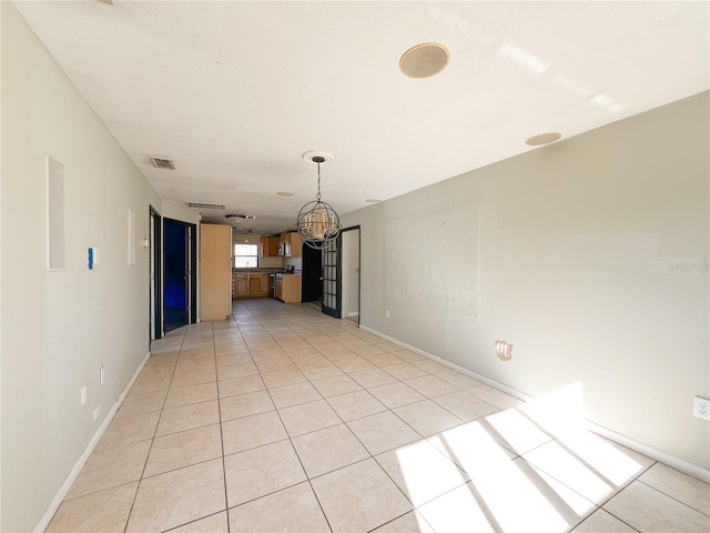 unfurnished living room featuring light tile patterned flooring