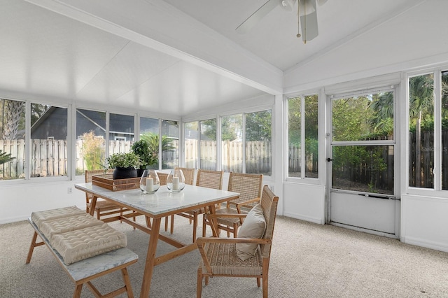 sunroom / solarium featuring ceiling fan and vaulted ceiling