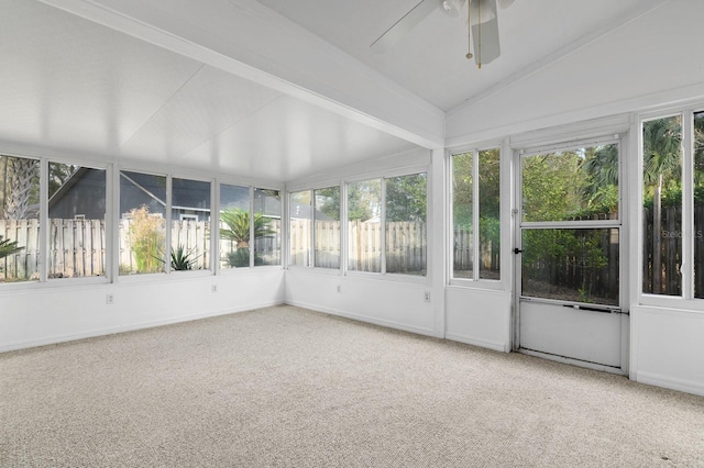 unfurnished sunroom featuring ceiling fan and vaulted ceiling