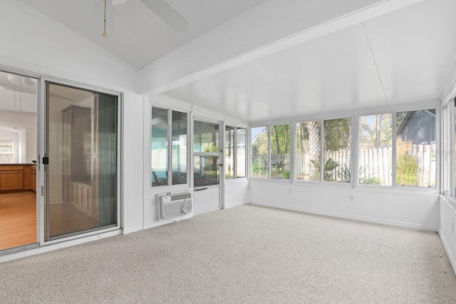 unfurnished sunroom with a wall mounted air conditioner, vaulted ceiling, and ceiling fan