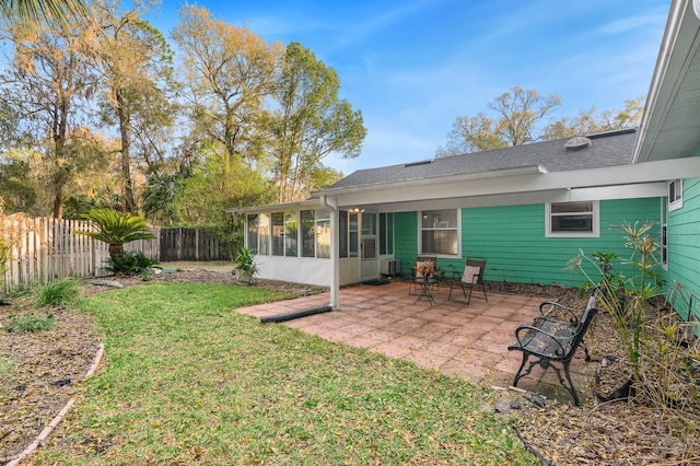 back of house with a patio, central AC, fence, a sunroom, and a lawn