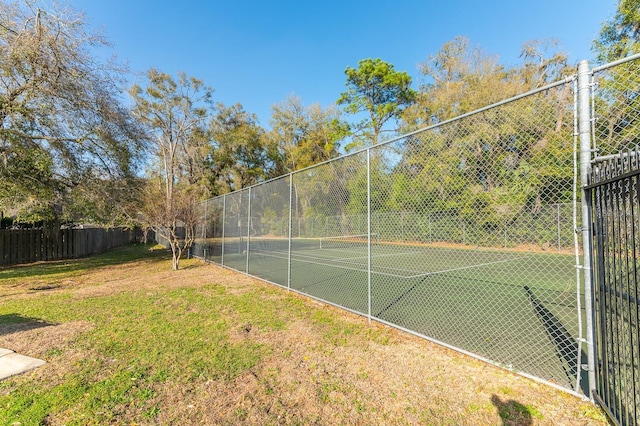 view of tennis court with fence