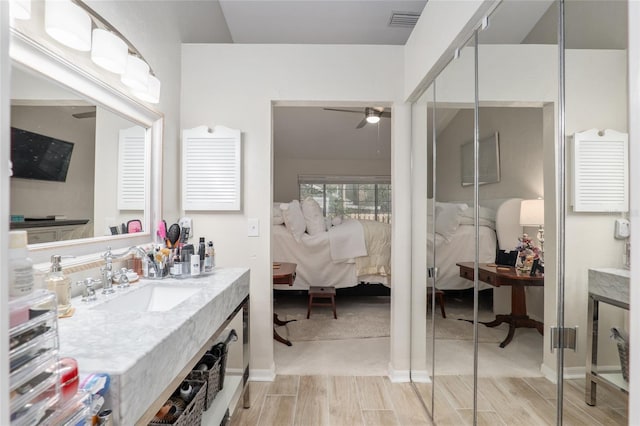 bathroom featuring vanity and ceiling fan