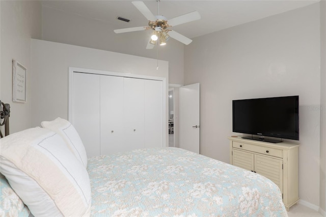 bedroom featuring ceiling fan and a closet