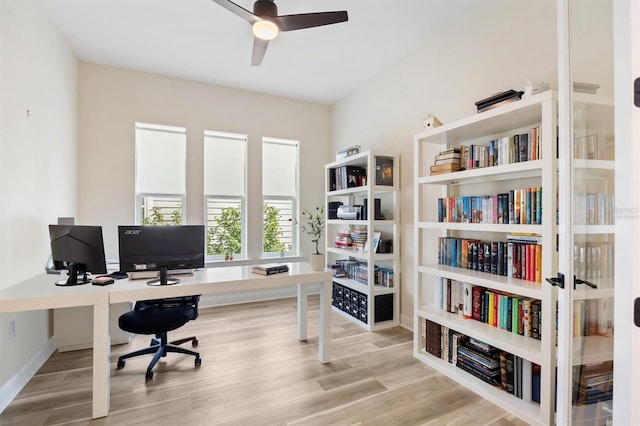 office area with wood finished floors, a ceiling fan, and baseboards