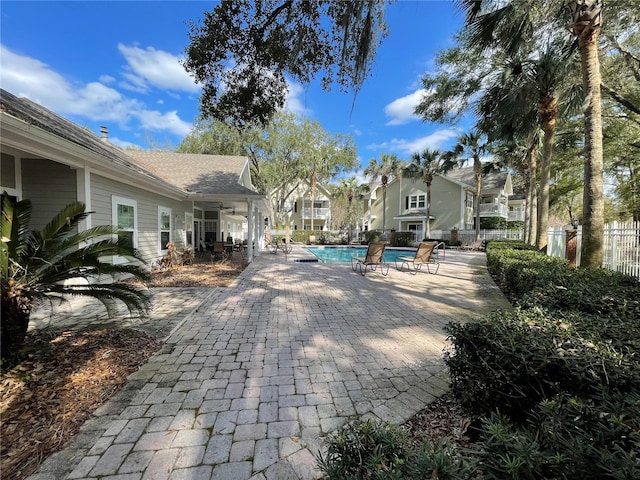 view of patio with a fenced in pool