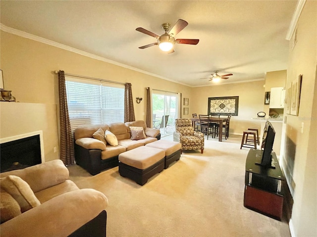 10000 SW 52nd Ave Unit 103, Gainesville, FL 32608 - living room featuring a ceiling fan, carpet flooring, a fireplace, and ornamental molding