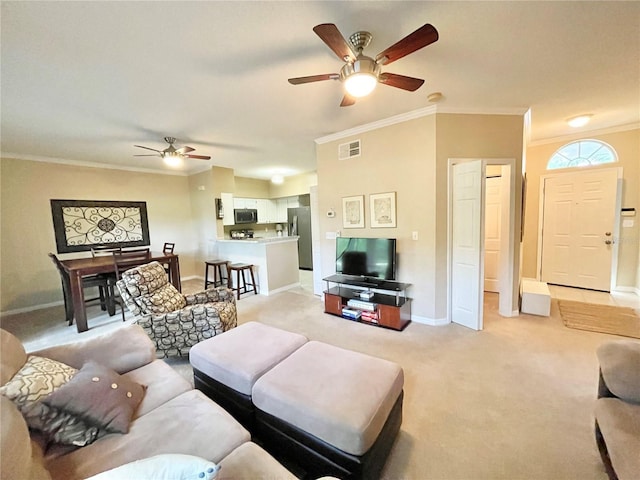 10000 SW 52nd Ave Unit 103, Gainesville, FL 32608 - living room featuring baseboards, ornamental molding, a ceiling fan, visible vents, and light colored carpet