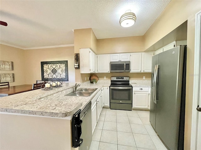 10000 SW 52nd Ave Unit 103, Gainesville, FL 32608 - kitchen with light tile patterned floors, light countertops, white cabinets, stainless steel appliances, and a sink