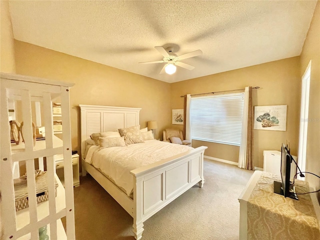 10000 SW 52nd Ave Unit 103, Gainesville, FL 32608 - bedroom with light carpet, baseboards, a ceiling fan, and a textured ceiling