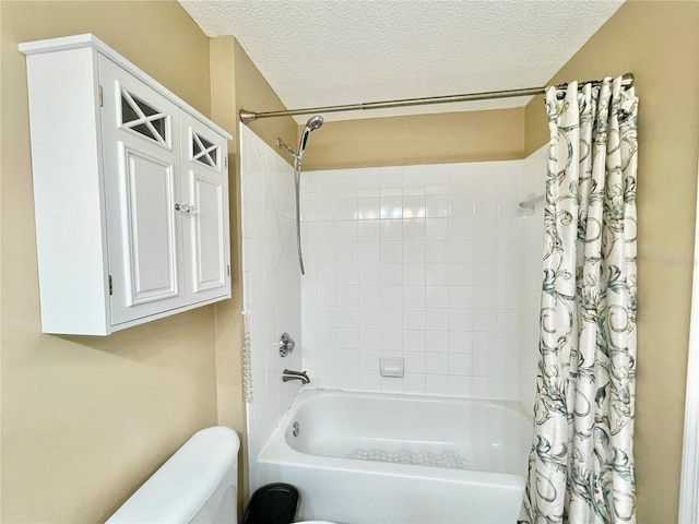 10000 SW 52nd Ave Unit 103, Gainesville, FL 32608 - full bath with toilet, a textured ceiling, and shower / tub combo with curtain