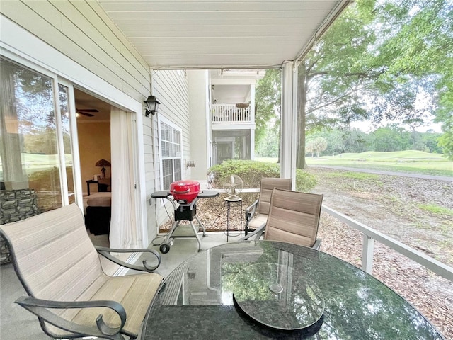 10000 SW 52nd Ave Unit 103, Gainesville, FL 32608 - sunroom with plenty of natural light and outdoor dining area