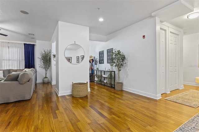 interior space featuring hardwood / wood-style floors and ceiling fan