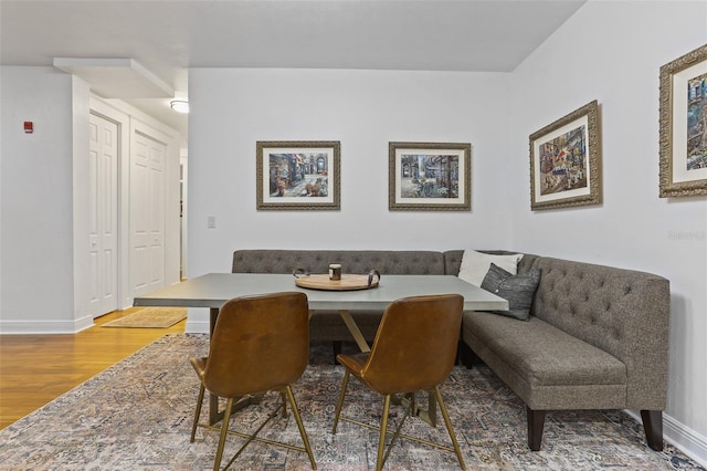 dining area with hardwood / wood-style flooring and breakfast area