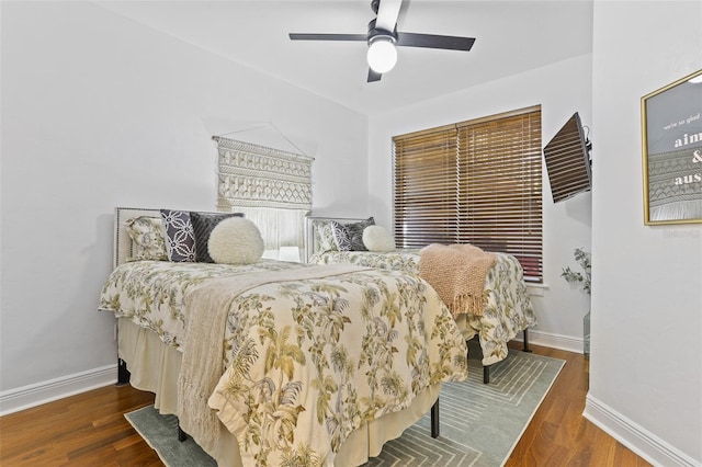 bedroom featuring ceiling fan and dark hardwood / wood-style flooring