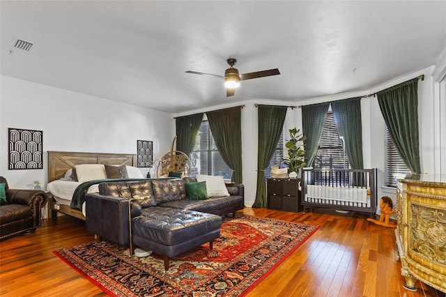 bedroom with ceiling fan and hardwood / wood-style floors