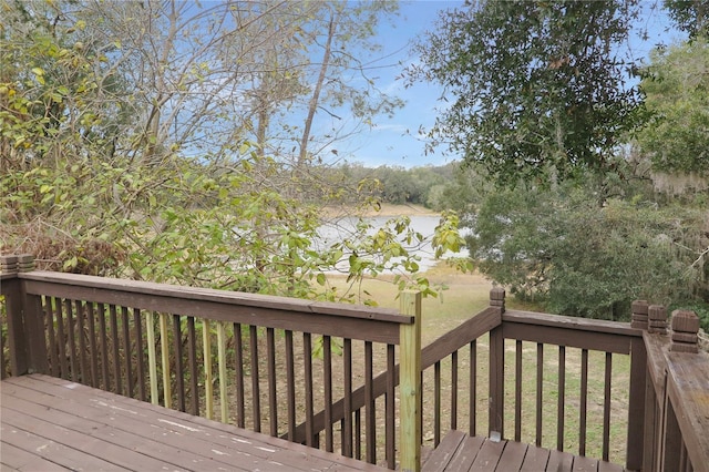 wooden deck featuring a yard