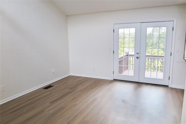 entryway featuring french doors and hardwood / wood-style flooring