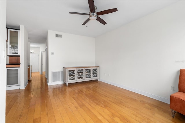 empty room featuring hardwood / wood-style flooring and ceiling fan