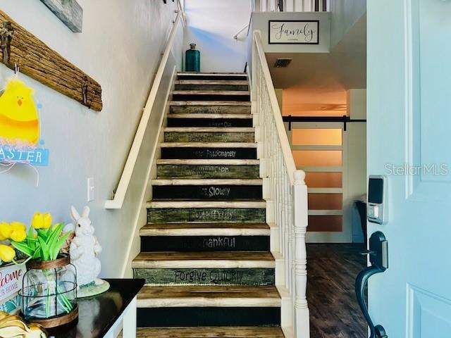 11607 NW 18th Pl, Gainesville, FL 32606 - stairs featuring wood finished floors and visible vents