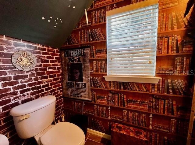 11607 NW 18th Pl, Gainesville, FL 32606 - bar featuring brick wall and vaulted ceiling