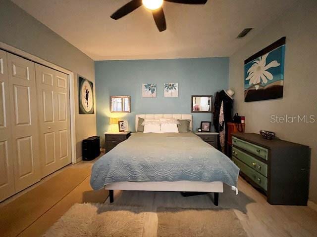 11607 NW 18th Pl, Gainesville, FL 32606 - bedroom with visible vents, a closet, and ceiling fan