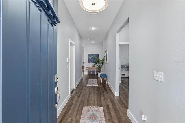 hall with dark wood-type flooring
