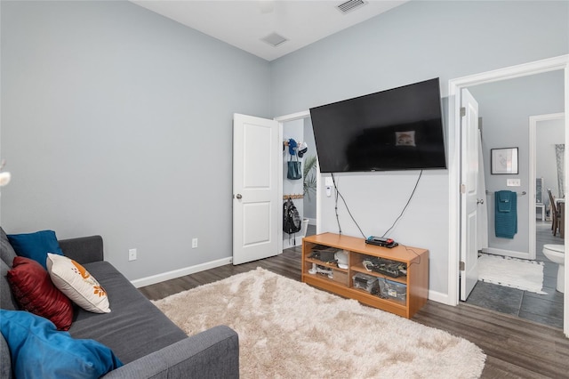 living room with dark hardwood / wood-style flooring