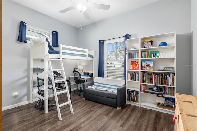 bedroom featuring dark hardwood / wood-style floors and ceiling fan